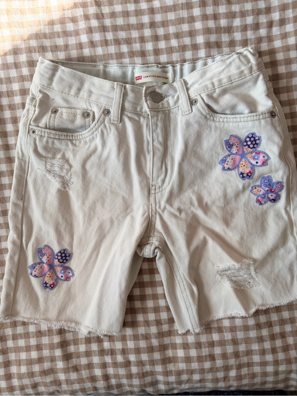 Levi's Cream Denim Shorts with Purple Floral Appliqués
